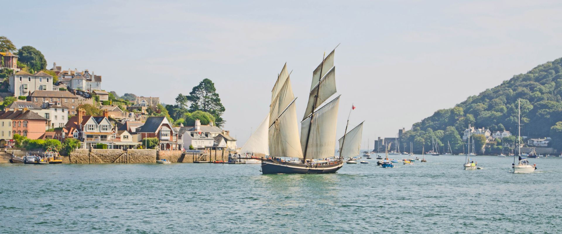 A sailing boat on the River Dart at Dartmouth and Kingswear