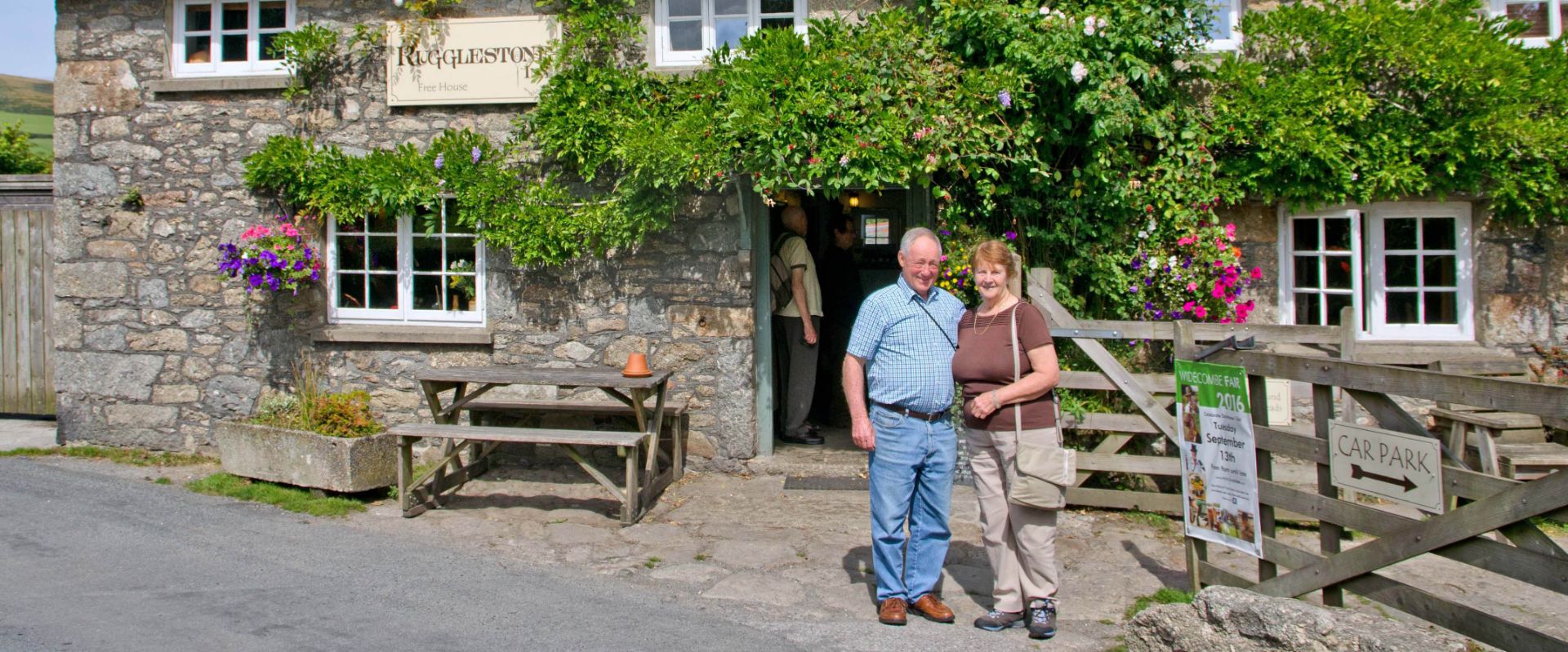 Guests outside The Rugglestone Inn at Widecombe